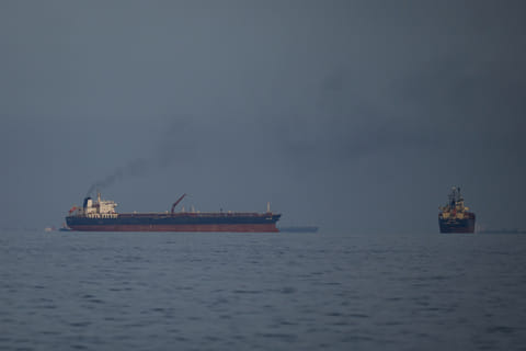 Oil tankers and cargo ships line up in the Strait of Hormuz. File photo taken on Wednesday, March 11, 2026. 