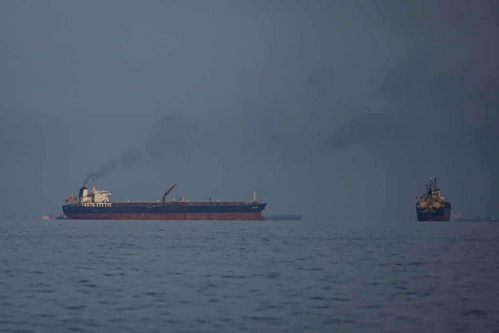 Oil tankers and cargo ships line up in the Strait of Hormuz as seen from Khor Fakkan, United Arab Emirates, Wednesday, March 11, 2026. 