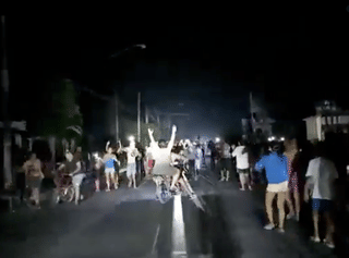Cuba ignites: Furious protesters storm and torch Communist Party HQ in blackout fury