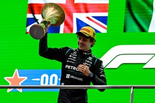 Winner Mercedes' Italian driver Kimi Antonelli celebrates on the podium after the Formula One Chinese Grand Prix at the Shanghai International Circuit in Shanghai on March 15, 2026.