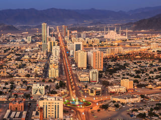 Fujairah contains blaze after suspected drone strike on industrial site.