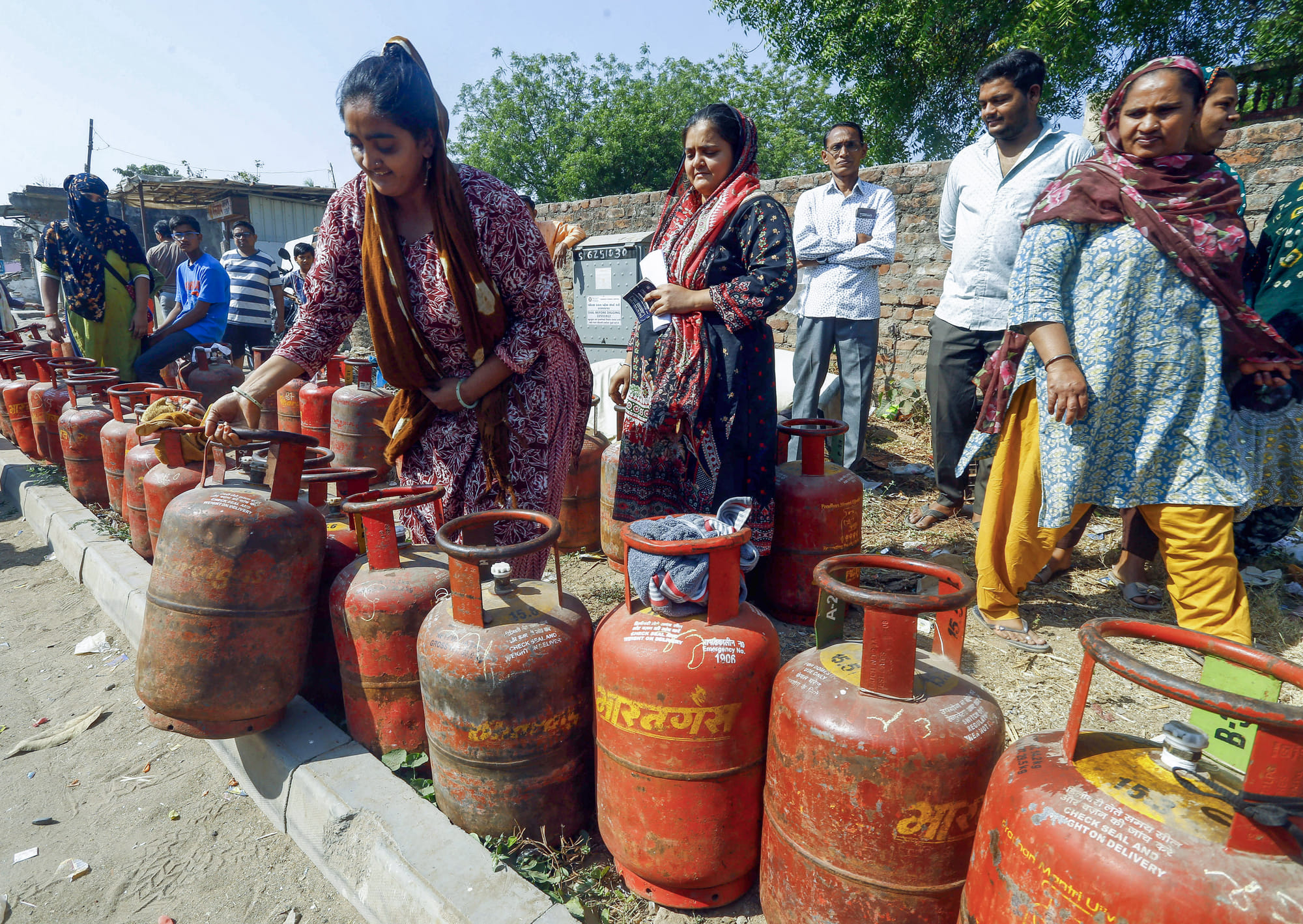 India is facing a deepening LPG crisis as shortages of cooking gas cylinders disrupt daily life across the country. Millions of households, along with hotels and small businesses, are struggling to secure regular supplies. Long queues outside gas agencies have become a common sight, while several eateries have been forced to shut temporarily due to lack of fuel. Above, people wait in a long queue to refill their LPG cylinders outside a gas agency amid reports of a nationwide shortage, in Ahmedabad.