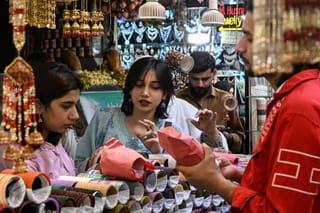 Women shop for bangles at a store in Lahore on March 17, 2026. Under the new decision, shops, departmental stores, bazaars, markets and shopping malls can now operate without restrictions on business hours throughout the week.