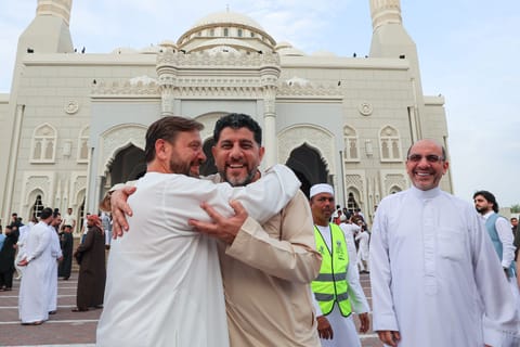 Joyful Eid moments: Friends and relatives exchange greetings at Al Noor Mosque, Sharjah.
