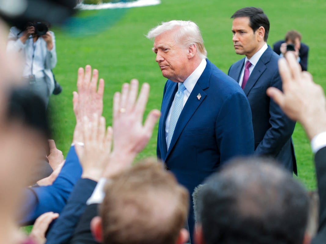 President Donald Trump and US Secretary of State Marco Rubio (R) stop to speak to reporters as he departs the White House on March 20 in Washington, DC.
