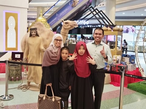 Nina Marie Juan with her husband and two children. 