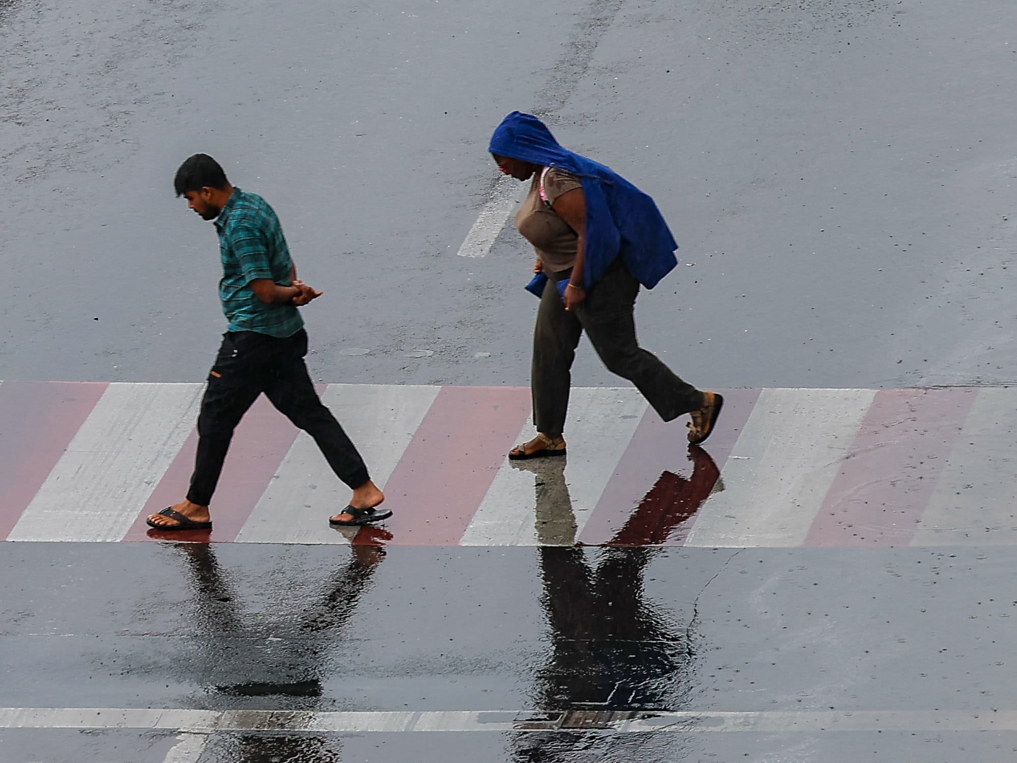 Residents caught in the rain at Al Majaz in Sharjah. 