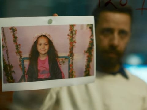The image shows Motaz Malhees in a scene from 'The Voice of Hind Rajab.' 