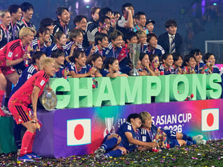 Japan's Maika Hamano celebrates with the trophy after winning the Women's Asian Cup soccer final against Australia in Sydney, Saturday, March 21, 2026. 