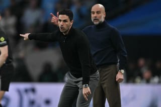 Manchester City's Spanish manager Pep Guardiola (R) and Arsenal's Spanish manager Mikel Arteta (L) gesture on the touchline during the English League Cup final football match between Arsenal and Manchester City at Wembley Stadium in London on March 22, 2026.