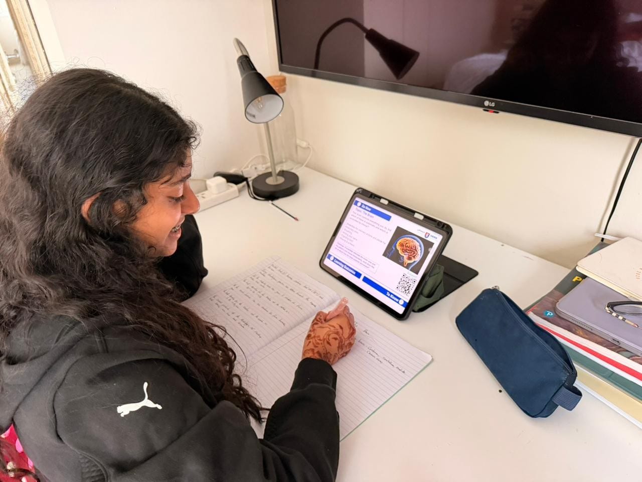Ameya Shanavas, a student of GEMS Founders School in Dubai, participates in remote learning from her home in Dubai on Monday.