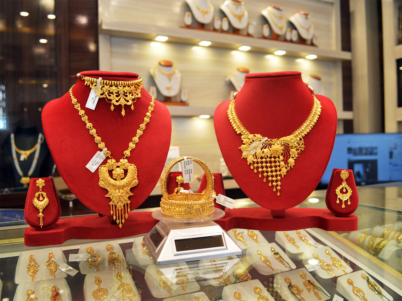 Gold necklaces displayed at a jewellery shop.