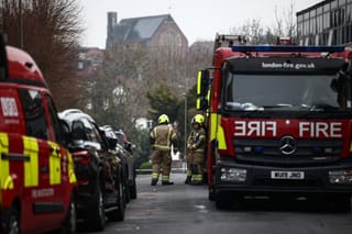 Firefighters are pictured in the Golders Green neighbourhood of north London on March 23, 2026, after volunteer ambulances run by a Jewish organisation were set on fire overnight.