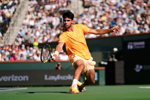 Carlos Alcaraz, of Spain, returns a shot against Daniil Medvedev, of Russia, during a semifinal match at the BNP Paribas Open tennis tournament, Saturday, March 14, 2026, in Indian Wells, Calif.