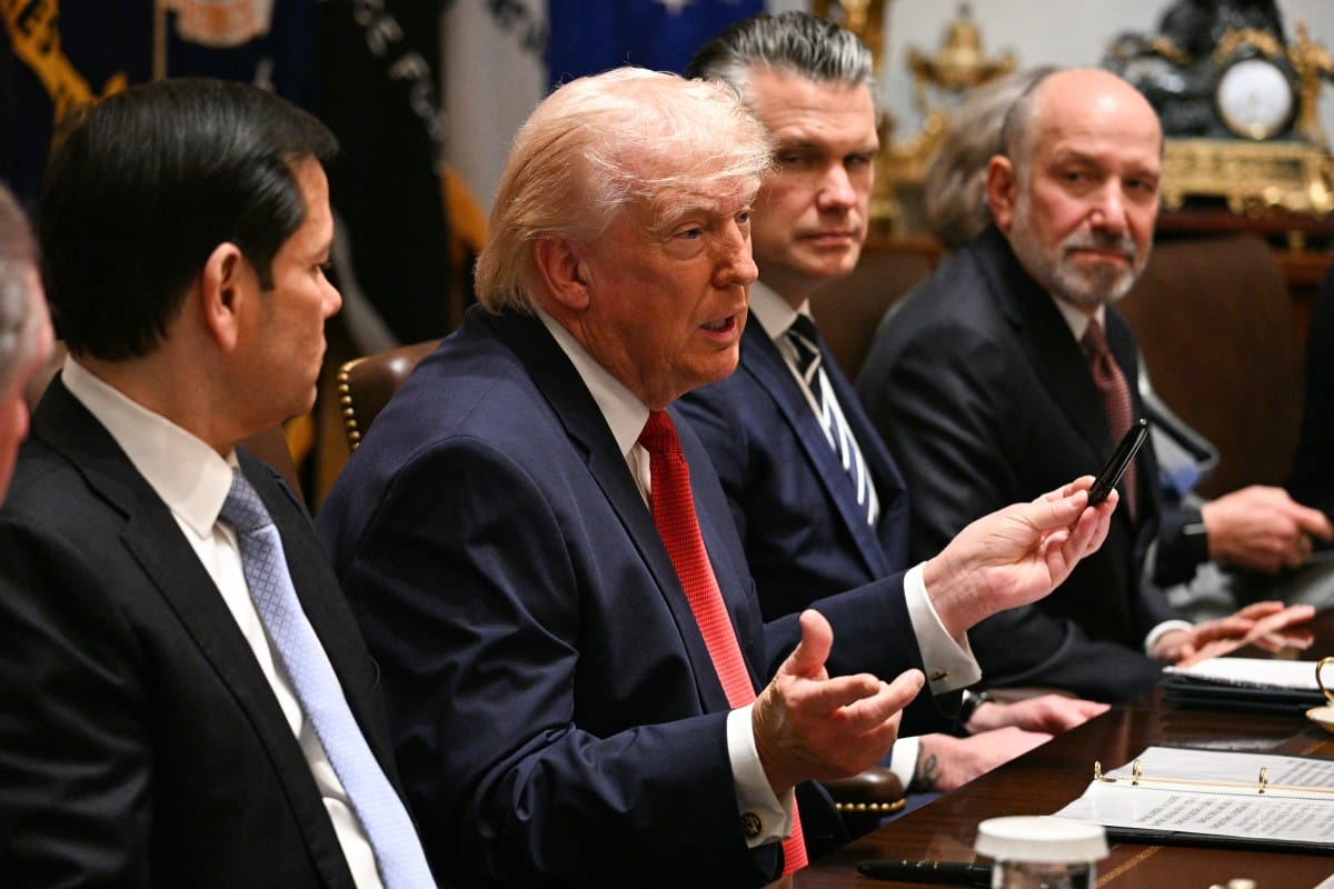 US President Donald Trump speaks, flanked by Secretary of State Marco Rubio (left), Defence Secretary Pete Hegseth (second right) and Commerce Secretary Howard Lutnick, during a cabinet meeting in the Cabinet Room of the White House in Washington, DC, on March 26, 2026.