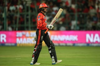 Sunrisers Hyderabad's Indian cricket player Abhishek Sharma walks back to the pavilion after his dismissal during the 2026 Indian Premier League (IPL) T20 match between Royal Challengers Bengaluru and Sunrisers Hyderabad at the M Chinnaswamy Stadium in Bengaluru on March 28, 2026.