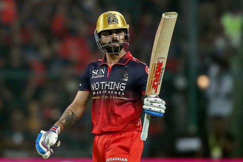 Royal Challengers Bengaluru's Indian cricket player Virat Kohli celebrates after scoring a half-century (50 runs) during the 2026 Indian Premier League (IPL) T20 match between Royal Challengers Bengaluru and Sunrisers Hyderabad at the M Chinnaswamy Stadium in Bengaluru on March 28, 2026.