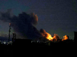 A plume of smoke rises from the site of a strike in Tehran on March 29, 2026.