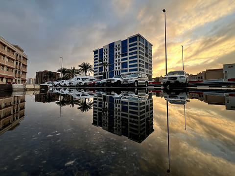 Dubai Creek mirrors the calm after rain, with soft clouds and glistening waters, captured by Harinath Vinu.