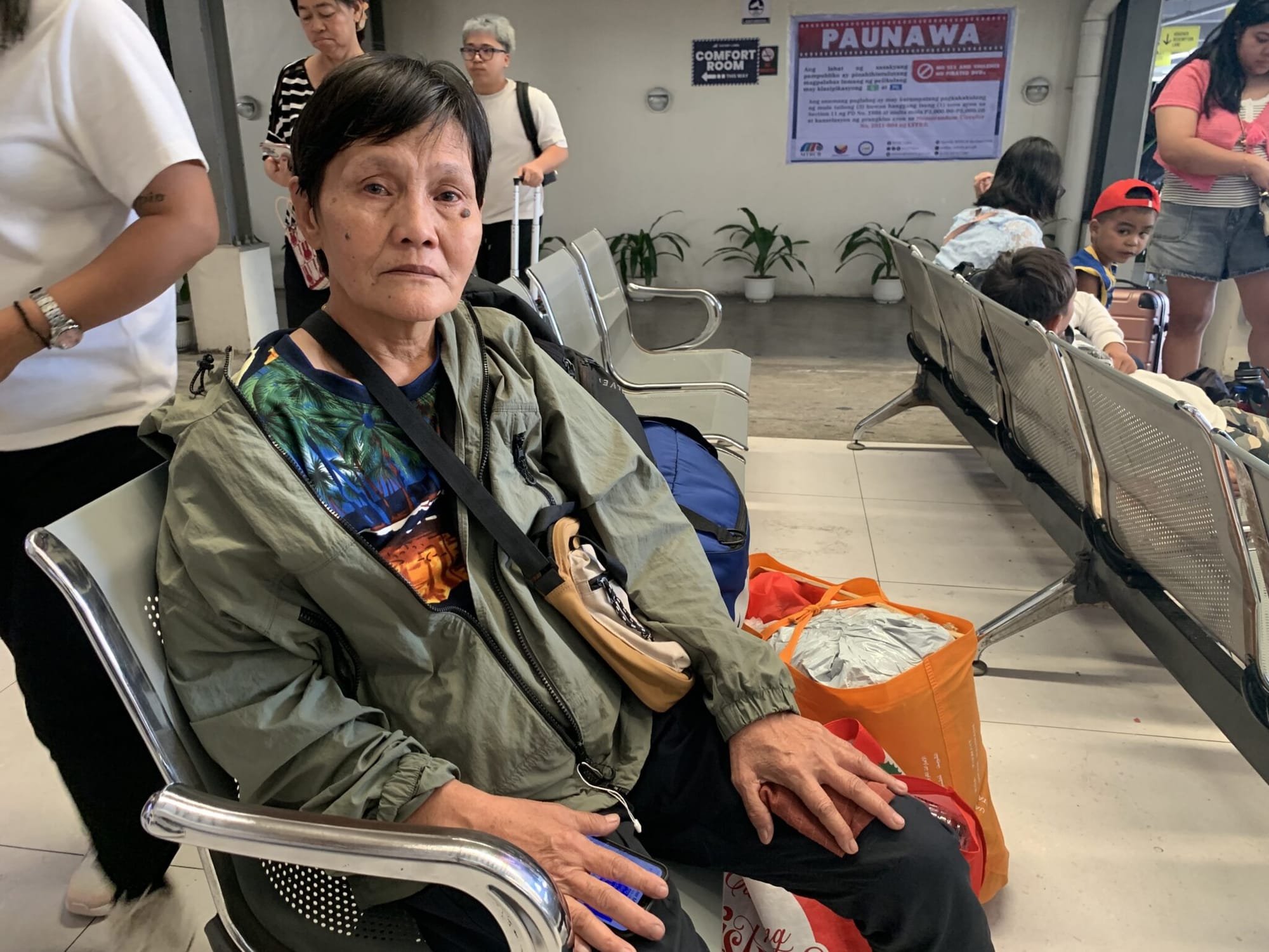 Carmen Pepito dela Cruz, 53, from Iligan City in Mindanao, quietly waits at the Victory Liner Terminal in Quezon City not for a ride home, but for something far more uncertain: a job.