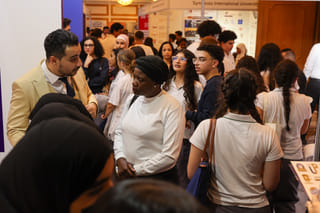 Students and parents interacting with exhibitors at Edufair in Abu Dhabi 