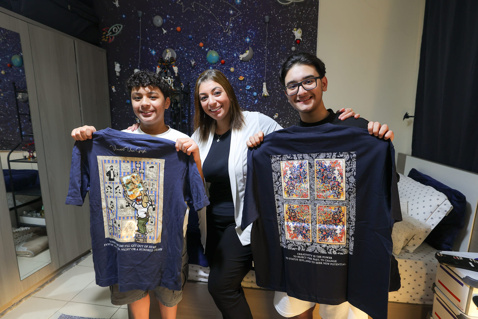 Single mother Randa Alawi with sons Badr mesayri and Bandr Mesayri who are helping her with thier business. 