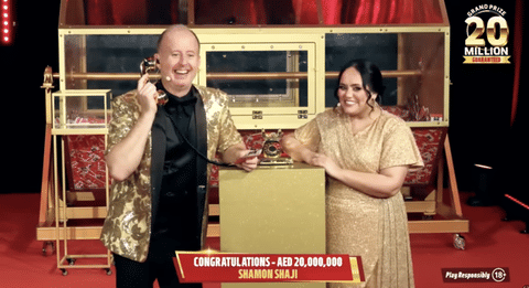 Show hosts Richard and Bouchra on the phone with Shaji during the live draw