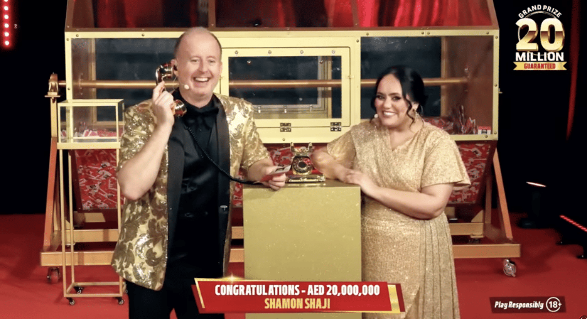 Show hosts Richard and Bouchra on the phone with Shaji during the live draw