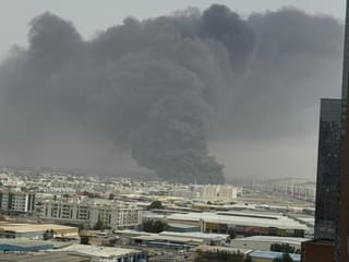 Civil Defence races to contain blaze and stop spread in busy industrial zone