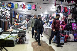 Police officers patrol a market in Islamabad on April 7, 2026. Authorities in Islamabad have ordered markets and shopping malls to close by 8pm.