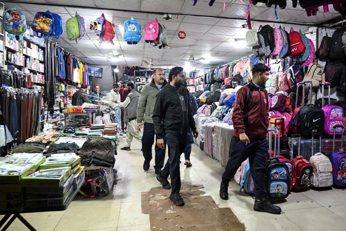 Police officers patrol a market in Islamabad on April 7, 2026. Authorities in Islamabad have ordered markets and shopping malls to close by 8pm.