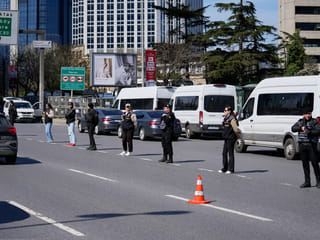 Turkish police secure the area after a gunmen attack at a building housing the Israeli Consulate in Istanbul, Turkey, Tuesday, April 7, 2026.  