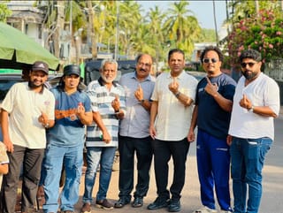 Nissar Thalangar (third from right) and members of KMCC who flew home to cast their votes in the Kerala Assembly Election 2026