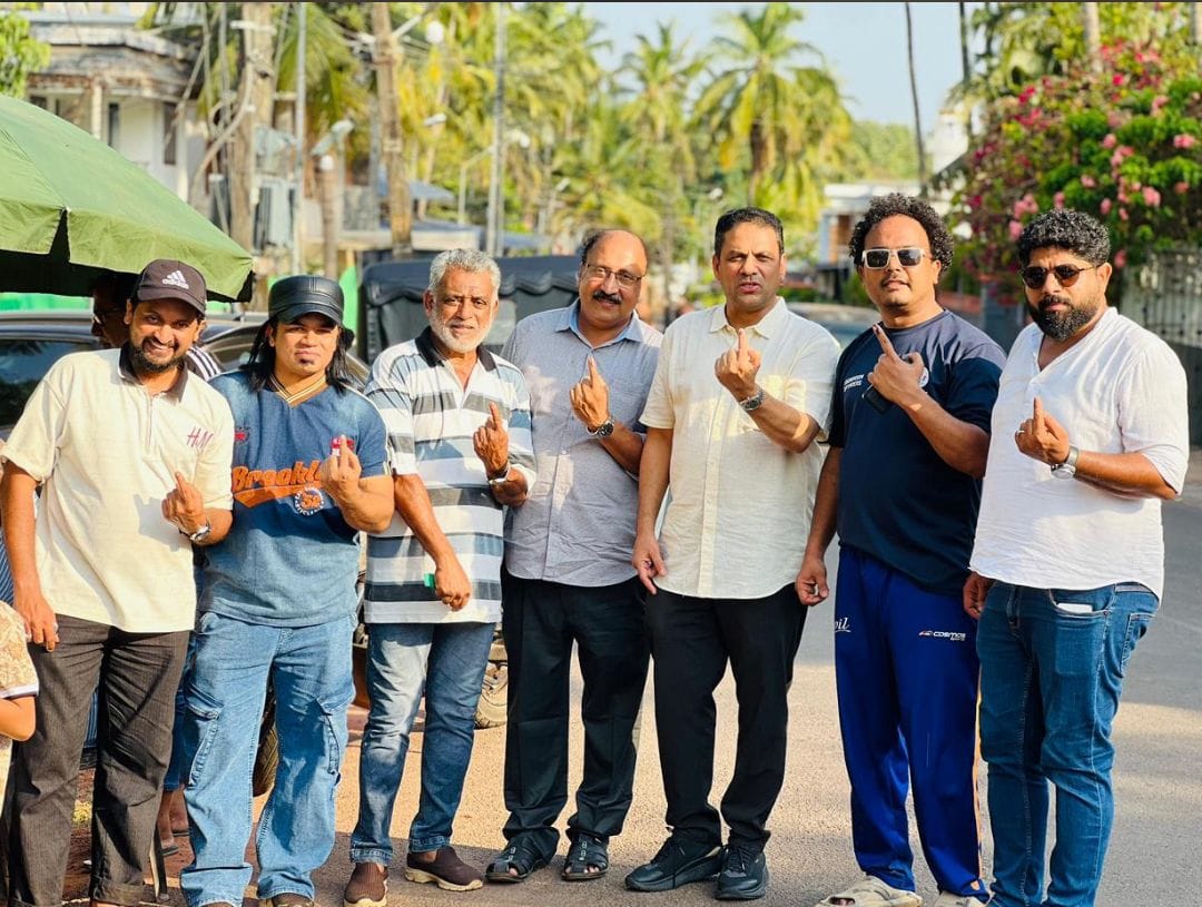 Nissar Thalangar (third from right) and members of KMCC who flew home to cast their votes in the Kerala Assembly Election 2026