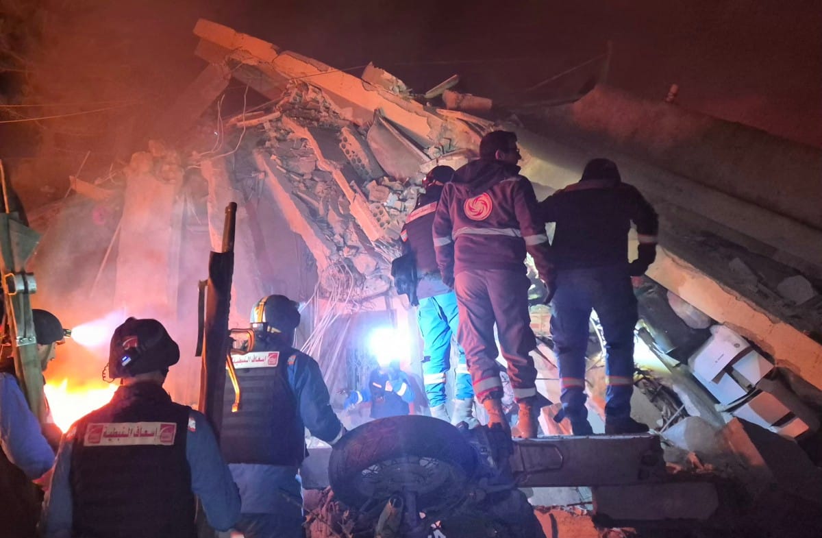 First responders search under the rubble at the site of an Israeli airstrike in the village of Habbouch, southern Lebanon on April 10, 2026.