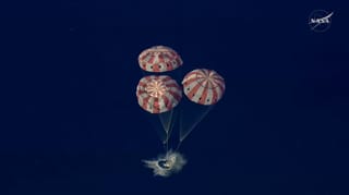 This video grab made from a NASA livestream shows Artemis II astronauts splashing down in the Pacific Ocean off the coast of San Diego, California, on April 10, 2026.