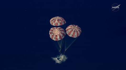 This video grab made from a NASA livestream shows Artemis II astronauts splashing down in the Pacific Ocean off the coast of San Diego, California, on April 10, 2026.