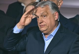 Hungary's Prime Minister Viktor Orban salutes supporters at the Balna centre in Budapest during a general election in Hungary, on April 12, 2026.