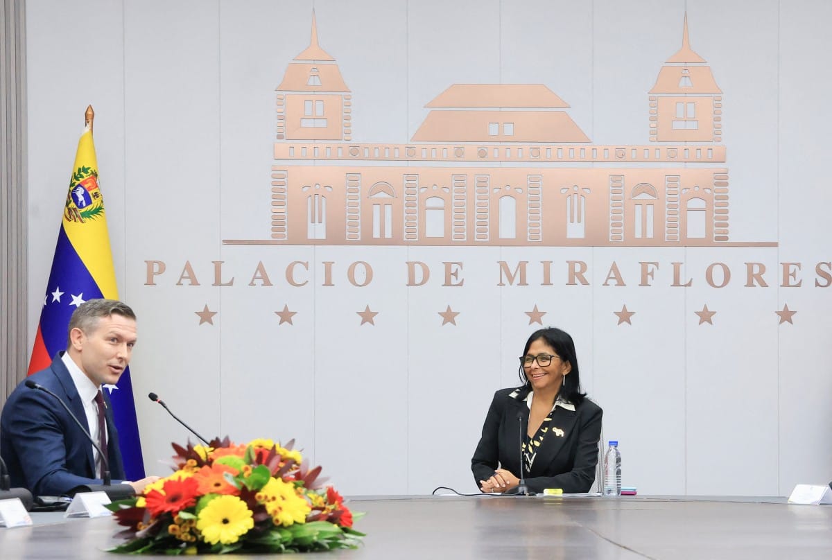 Handout picture released by Venezuelan Presidency shows Venezuela's interim President Delcy Rodriguez meeting with US Assistant Secretary of Energy Kyle Haustveit at Miraflores presidential palace in Caracas om April 14, 2026.