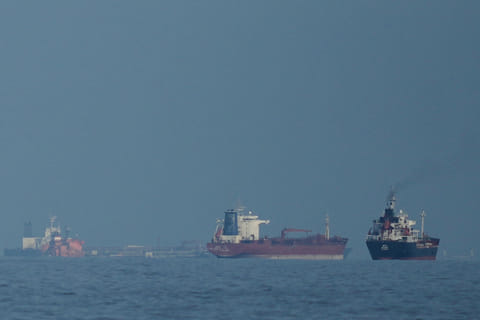 A view of ships passing through the narrow but strategic Strait of Hormuz between Oman and Iran.
