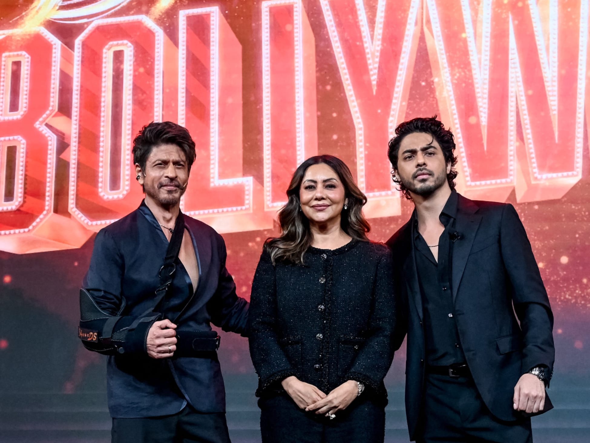 Bollywood actor Shah Rukh Khan (L) with his wife Gauri Khan (C) and his son Aryan Khan attends the preview of his son's directorial debut, Netflix's series 'The Ba***ds of Bollywood’, in Mumbai on August 20, 2025.