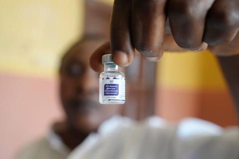 A health worker shows a bottle of the malaria vaccine R21/Matrix-M before administering it to a child at the comprehensive Health Centre in Agudama-Epie, in Yenagoa, Nigeria, on Dec. 9, 2024. 
