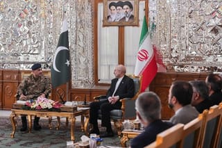This handout photo taken and provided by the Office of Iranian Parliament Speaker on April 16, 2026 shows Iranian Parliament speaker Mohammad Bagher Ghalibaf (C) speaking with Pakistan's Army Chief Asim Munir (L) during their meeting in Tehran.