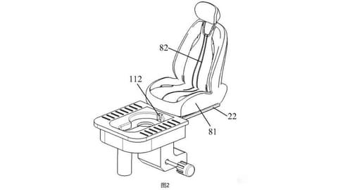 The on-the-go lavatory can be accessed manually through pushing the seat back.