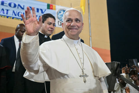 Pope Leo XIV waves to supporters as he leaves after his visit to the Ngul Zamba (Power of God) orphanage in Yaounde, Cameroon, Wednesday April 15, 2026 on the third day of his apostolic journey to Africa.