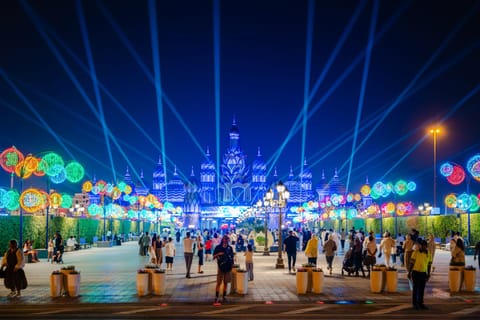 A look at a lit-up Global Village which re-opens today at 5pm