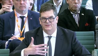 In this video grab taken from footage broadcast by the UK Parliamentary Recording Unit (PRU) via the Parliament TV website on April 21, 2026, former permanent under-secretary at the Foreign, Commonwealth and Development Office (FCDO), Olly Robbins (c), speaks on the work of the FCDO in the Boothroyd Room at Portcullis House, Westminster in London.
