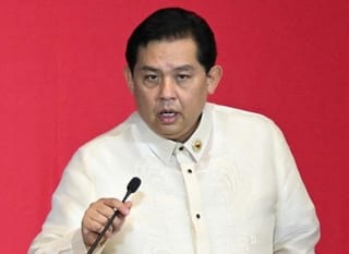File photo taken on July 28, 2025 shows ex-Speaker of the House Martin Romualdez (R) during the State of the Nation Address at the House of Representatives in Manila. Romualdez stepped down as Congress speaker in September amid the probe into fake flood-control projects which has kicked up public anger.