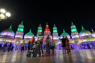 Visitors arrive during the night time at season 30 of Global Village which reopened after a month-long pause. 