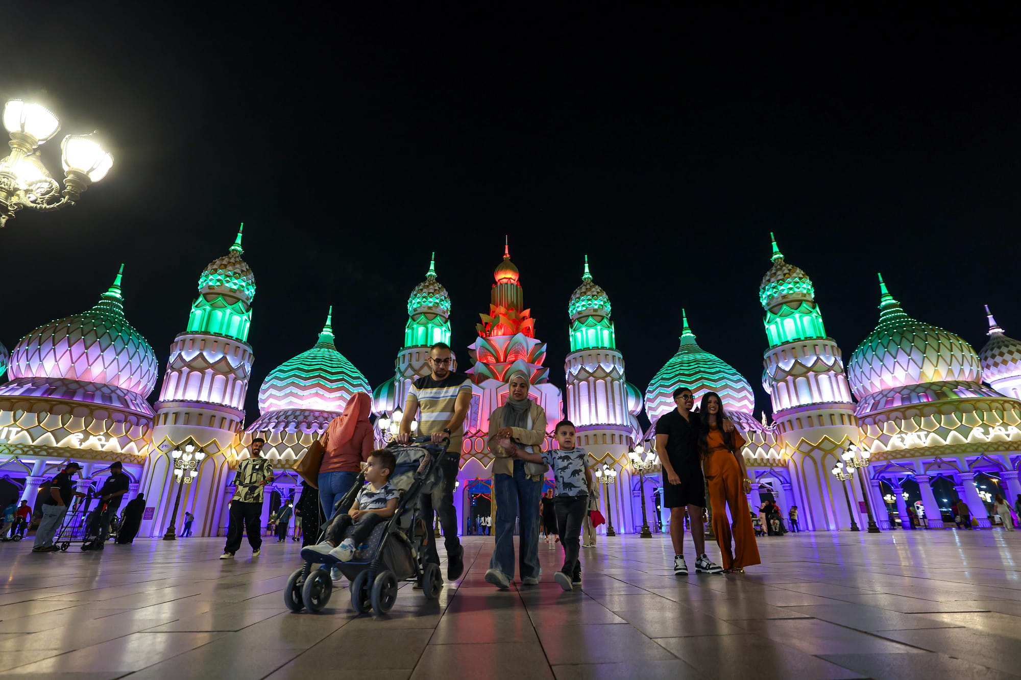 Visitors arrive during the night time at season 30 of Global Village which reopened after a month-long pause.